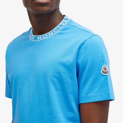 Blue t-shirt with Moncler logo on a white background