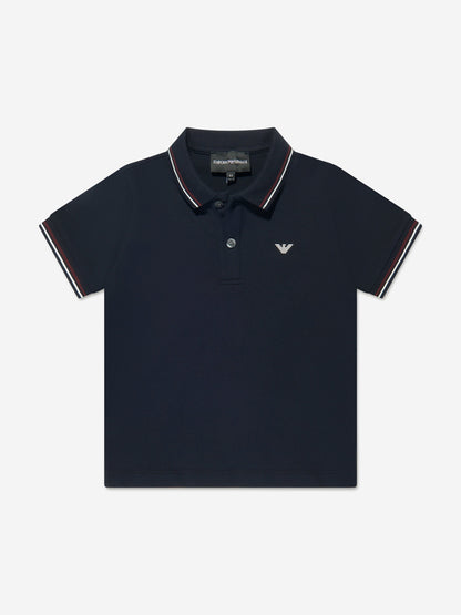 Navy blue polo shirt with white trim on a light gray background