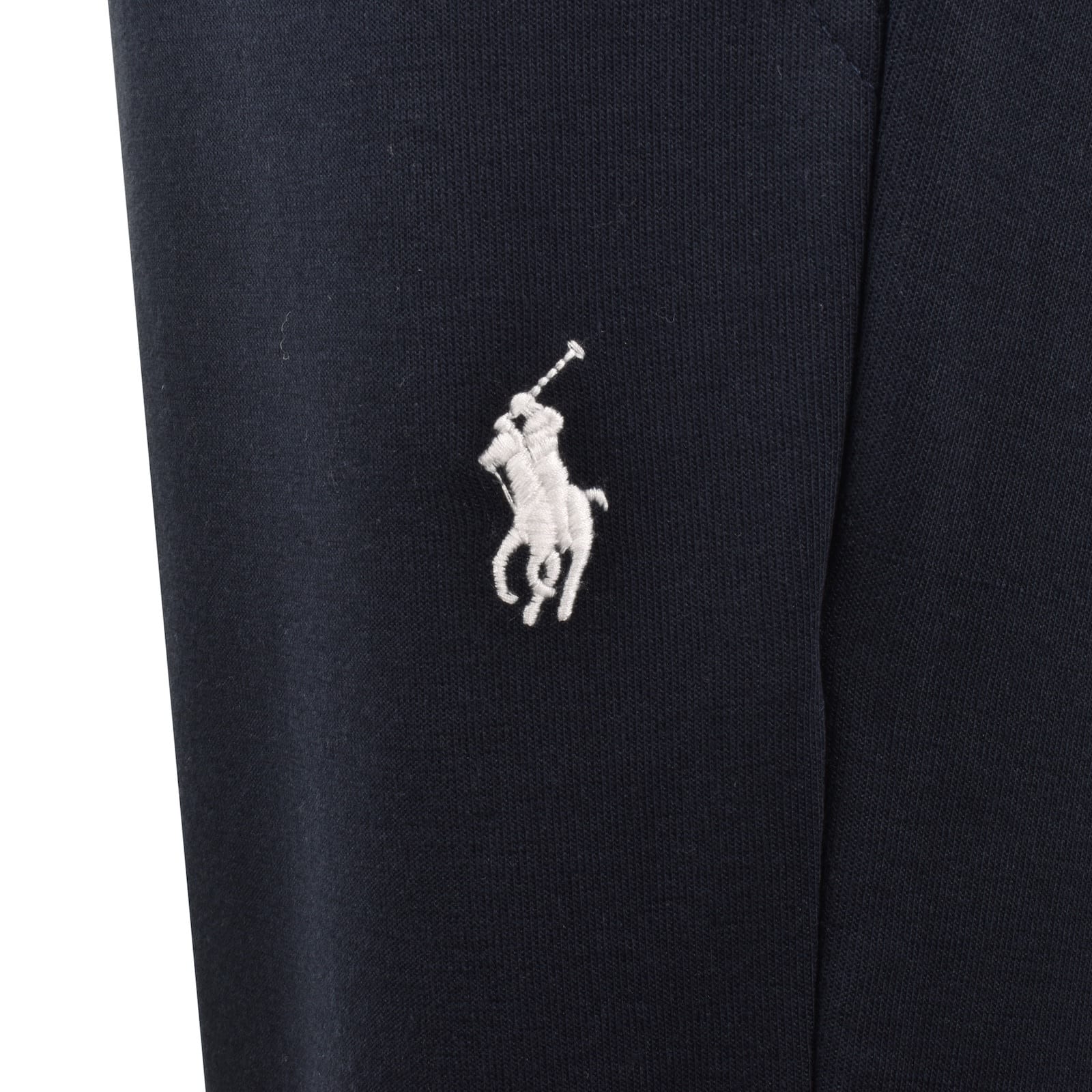 Navy blue pants with a white embroidered logo on a white background