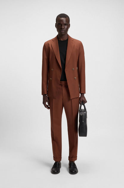 Man wearing a brown suit holding a black briefcase on a white background