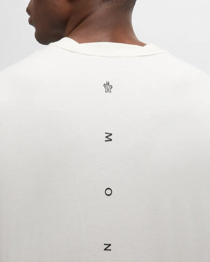 White t-shirt with black text on a plain background