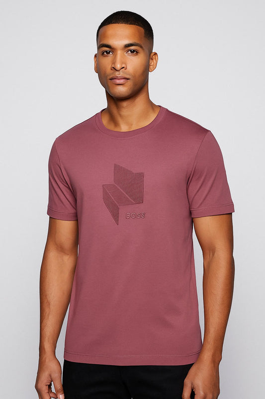 Man wearing a maroon t-shirt with a logo on a light gray background